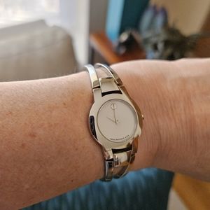 Movado ladies dress bracelet watch in silver tone.